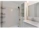 Bathroom features white subway tile shower and sleek vanity with shelves at 2025 Oakley Se Trce, Smyrna, GA 30080