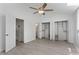 Spacious bedroom with ceiling fan, ample closet space, and hardwood flooring at 2025 Oakley Se Trce, Smyrna, GA 30080