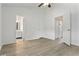 Open bedroom boasts fresh paint, laminate floors, and access to the bathroom and closets at 2025 Oakley Se Trce, Smyrna, GA 30080