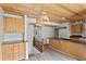 Open-concept kitchen with stainless steel appliances, granite countertops, and wood ceiling at 2025 Oakley Se Trce, Smyrna, GA 30080