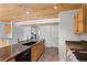 Bright kitchen features wood plank ceiling, granite countertops, and stainless appliances at 2025 Oakley Se Trce, Smyrna, GA 30080