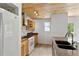 Bright kitchen features a white refrigerator and ample counter space at 2025 Oakley Se Trce, Smyrna, GA 30080