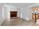 Bright living room featuring hardwood floors, a fireplace, and white walls at 2025 Oakley Se Trce, Smyrna, GA 30080