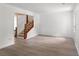 Living room featuring light hardwood floors and access to the staircase at 2025 Oakley Se Trce, Smyrna, GA 30080