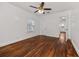 Unfurnished bedroom shows hardwood floors, ceiling fan and view to next room at 2584 Oldknow Dr, Atlanta, GA 30318