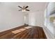 Unfurnished bedroom features hardwood flooring, ceiling fan, and large windows at 2584 Oldknow Dr, Atlanta, GA 30318