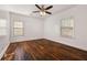 Bright bedroom with hardwood floors, white walls, and two windows for natural light at 2584 Oldknow Dr, Atlanta, GA 30318
