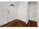 Bright entryway featuring beautiful dark hardwood floors and a traditional white door at 2584 Oldknow Dr, Atlanta, GA 30318