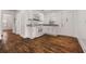 Efficient kitchen features white cabinets, granite counters and appliances, with hardwood flooring at 2584 Oldknow Dr, Atlanta, GA 30318