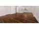 Hardwood floors throughout an open living room and kitchen area with bright white paint at 2584 Oldknow Dr, Atlanta, GA 30318