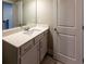 Neutral bathroom with a single sink vanity with a white countertop and a large mirror at 360 Hayden Cir, Woodstock, GA 30189