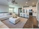 Bright and open living room with hardwood floors connects to the kitchen and dining area, perfect for entertaining at 360 Hayden Cir, Woodstock, GA 30189