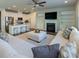Spacious living space with kitchen island, modern fireplace, and sleek furnishings at 360 Hayden Cir, Woodstock, GA 30189