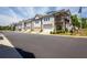 Row of new townhomes featuring attached garages in a well-maintained community at 360 Hayden Cir, Woodstock, GA 30189