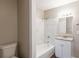 Bathroom with white tile surround and granite vanity countertop at 4650 Big Valley Ct, Stone Mountain, GA 30083