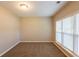 Bedroom with neutral walls and carpet with a window allowing natural light at 4650 Big Valley Ct, Stone Mountain, GA 30083