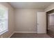 Bedroom with gray walls, neutral carpet, and a window with white blinds at 4650 Big Valley Ct, Stone Mountain, GA 30083