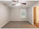 Comfortable bedroom with soft carpeting, neutral walls, and an inviting ceiling fan at 4650 Big Valley Ct, Stone Mountain, GA 30083