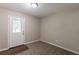 Bedroom with neutral carpet, gray walls, and door to the outside at 4650 Big Valley Ct, Stone Mountain, GA 30083