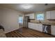 Modern kitchen boasting stainless steel appliances, granite countertops, and wood-look floors at 4650 Big Valley Ct, Stone Mountain, GA 30083