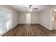 Spacious living room boasting sleek flooring, neutral walls, and convenient backyard access at 4650 Big Valley Ct, Stone Mountain, GA 30083