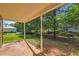 Home featuring covered patio, manicured lawn, and mature landscaping at 484 Cathedral Dr, Mcdonough, GA 30253