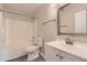 This updated bathroom features a shower-tub combination, a toilet, a mirror, and a vanity at 484 Cathedral Dr, Mcdonough, GA 30253