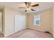 This bedroom has neutral walls, carpet, a window, and a double closet at 484 Cathedral Dr, Mcdonough, GA 30253