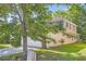 Side view of home with a well-maintained lawn, brick, and vinyl siding at 484 Cathedral Dr, Mcdonough, GA 30253