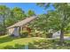 Inviting single-story home with lush landscaping, brick accents, and a two-car garage at 484 Cathedral Dr, Mcdonough, GA 30253