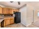 Functional kitchen featuring wood cabinets, and neutral tile backsplash at 484 Cathedral Dr, Mcdonough, GA 30253