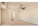 Large main bedroom featuring carpet, ceiling fan, and an ensuite bathroom at 484 Cathedral Dr, Mcdonough, GA 30253