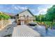 Spacious deck area with a hot tub and outdoor seating overlooking the yard at 850 Old Spring Way, Sugar Hill, GA 30518