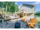 Relaxing backyard featuring a spa, deck, and comfortable seating at 850 Old Spring Way, Sugar Hill, GA 30518