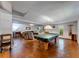 Spacious finished basement with a pool table, lounge area, and convenient walk-out access at 850 Old Spring Way, Sugar Hill, GA 30518