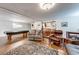 Finished basement featuring a pool table, bar area, and comfortable seating at 850 Old Spring Way, Sugar Hill, GA 30518