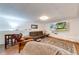 Basement sitting area with large screen television and area rug at 850 Old Spring Way, Sugar Hill, GA 30518