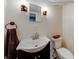 Cozy bathroom featuring an undermount sink, mirrored medicine cabinet, and a toilet at 850 Old Spring Way, Sugar Hill, GA 30518