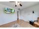 Bedroom featuring hardwood floors, a wall-mounted television, and natural light at 850 Old Spring Way, Sugar Hill, GA 30518