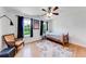 Bedroom with hardwood floors, a bed, and two windows at 850 Old Spring Way, Sugar Hill, GA 30518