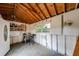 Interior of the shed with pegboard walls, shelving, and a small table and chairs at 850 Old Spring Way, Sugar Hill, GA 30518