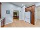 View of a kitchen with wood floors and stainless steel refrigerator at 850 Old Spring Way, Sugar Hill, GA 30518