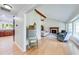 Open-concept living room with vaulted ceilings, a fireplace, and hardwood floors at 850 Old Spring Way, Sugar Hill, GA 30518