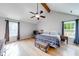Spacious main bedroom with vaulted ceiling, fan, and natural light at 850 Old Spring Way, Sugar Hill, GA 30518