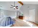 Bright main bedroom with vaulted ceiling, hardwood floors, and a TV at 850 Old Spring Way, Sugar Hill, GA 30518