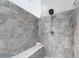Close up of a luxurious tiled shower with modern fixtures at 850 Old Spring Way, Sugar Hill, GA 30518