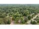 An aerial view of a house with lush greenery and mature trees, offering a sense of privacy and tranquility at 550 Stewart Nw Ave, Marietta, GA 30064