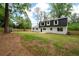 A beautifully fenced backyard features lush green grass, providing a private and serene outdoor space at 550 Stewart Nw Ave, Marietta, GA 30064