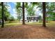 A large backyard with new fencing and mature trees creates a private and inviting outdoor space at 550 Stewart Nw Ave, Marietta, GA 30064