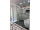 Elegant bathroom with a glass-enclosed shower, soaking tub, and luxurious marble tile at 550 Stewart Nw Ave, Marietta, GA 30064